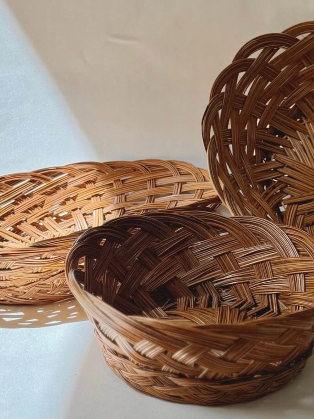 Set of Three 1970s Hand-Woven Rattan Baskets